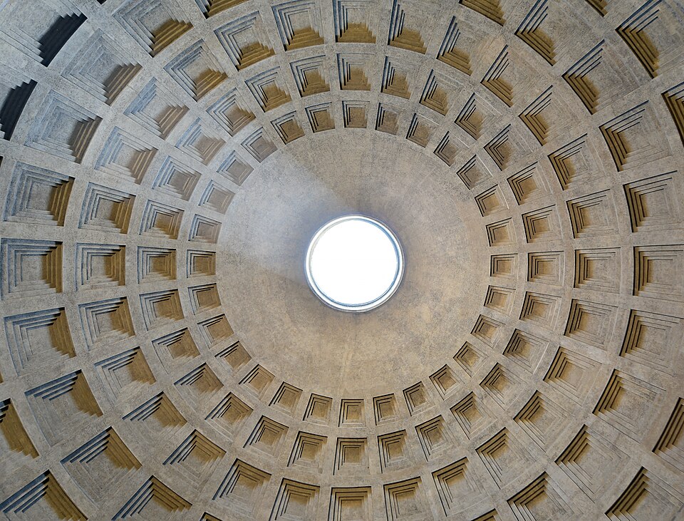 Looking up at the coffered dome of the Pantheon, with the circular oculus open to the sky at the center